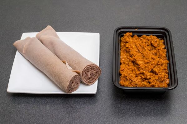 Ethiopian misir wot, a spicy red lentil stew, served with injera and rich berbere seasoning.