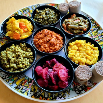 Delicious Ethiopian platter featuring injera, doro wat, tibs, and lentil stews at an authentic Ethiopian restaurant.